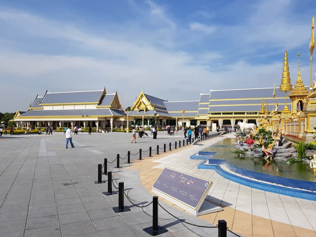 Rows of century-old tamarind trees along the square's edge, the densest shade in the old town. — Sanam Luang, Bangkok, Thailand